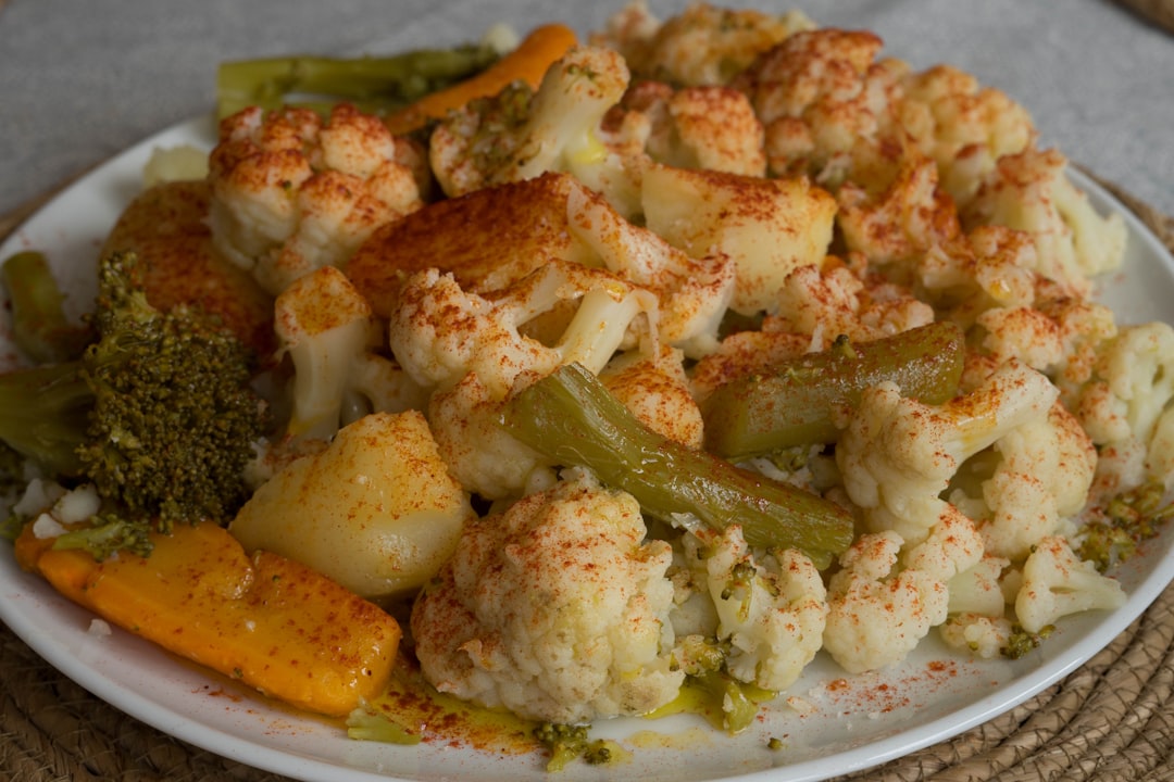 Crafting Captivating Headlines: Your awesome post title goes here This is a photograph of a healthy summer plate of food. It is a salad of cauliflower, carrots, peppers, potatoes, parsley, paprika and olive oil served on a large plate to distribute among the diners.